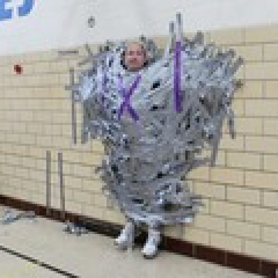 Point Elementary principal duct taped to wall as part of fundraising efforts