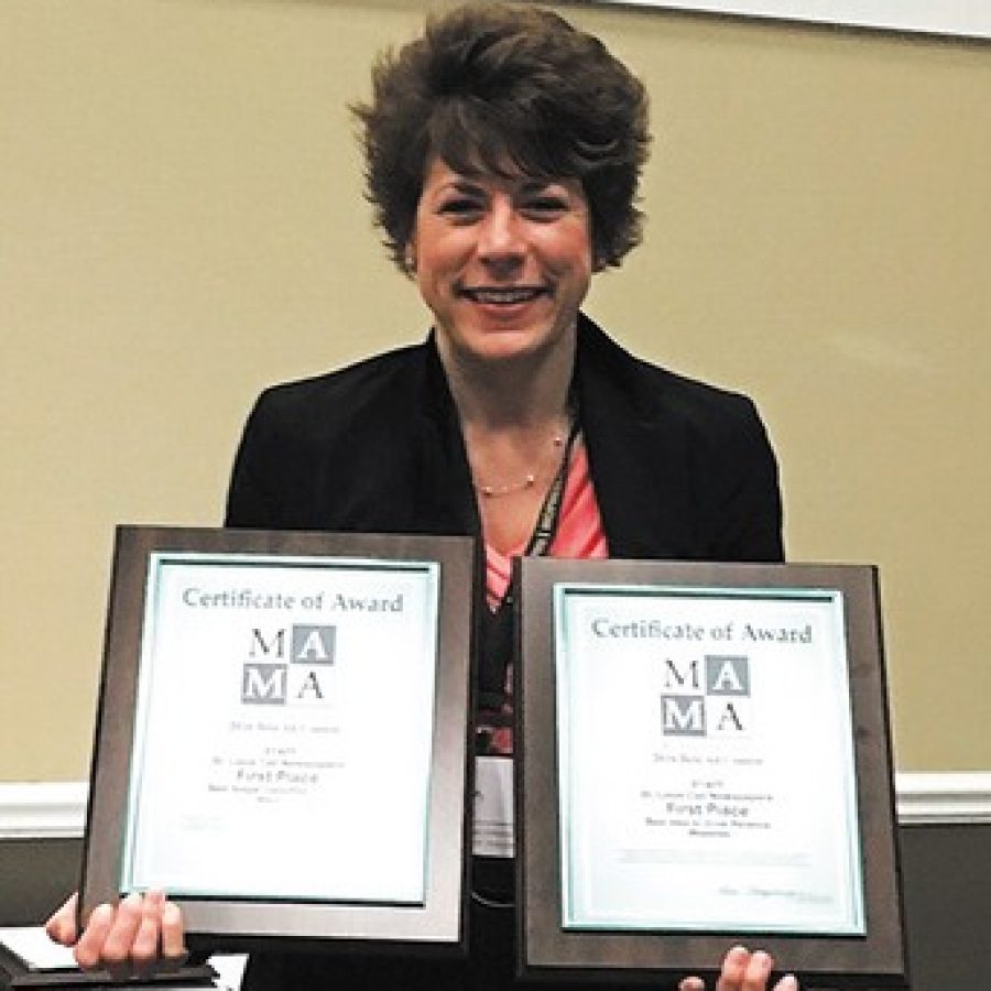 Sales Executive Bea Corbin displays the first-place awards the Call won last week at the Missouri Press Associations Best Ad Contest at Lake of the Ozarks. 