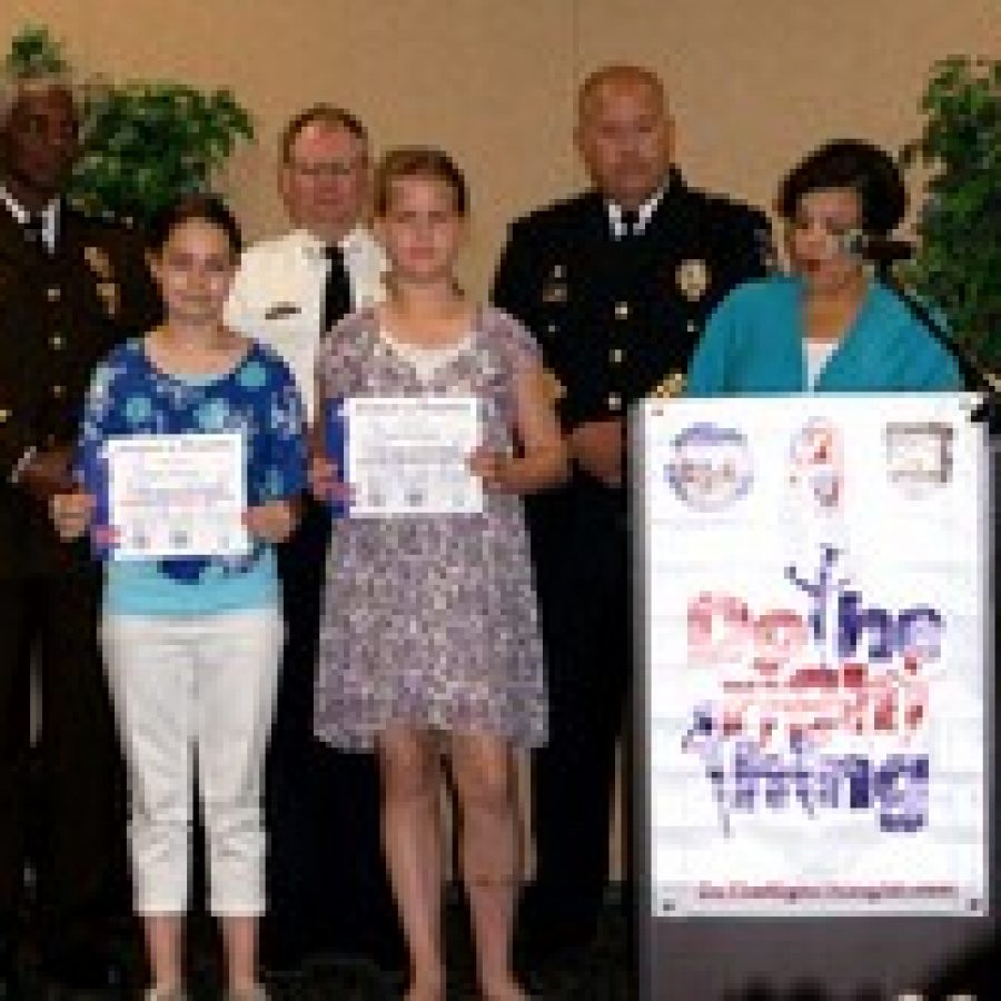 Blades Elementary fifth-graders Rachel Pleimann left and Grace Fedorchak were celebrated for their kindness by the Do The Right Thing Program of Greater St. Louis at its recognition ceremony held today, May 16, at the National Shrine of Our Lady of the Snows in Belleville, Ill.

Pictured in back from left are St. Louis County Police Lt. Col. Kenneth Gregory, St. Louis Metropolitan Police Department Capt. Steve Miller, Troy, Ill., Police Chief Robert Rizzi, and KMOV news anchor Robin Smith. 