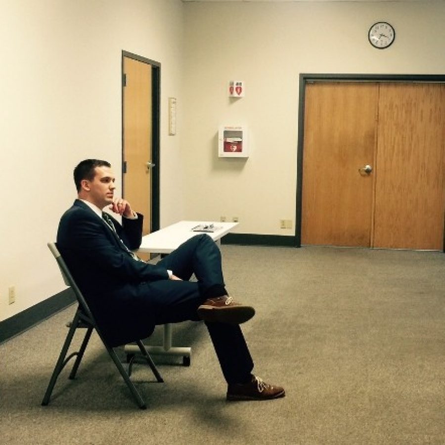 St. Louis County Election Director Eric Fey waits outside an election board closed session Tuesday afternoon to find out the boards decision.