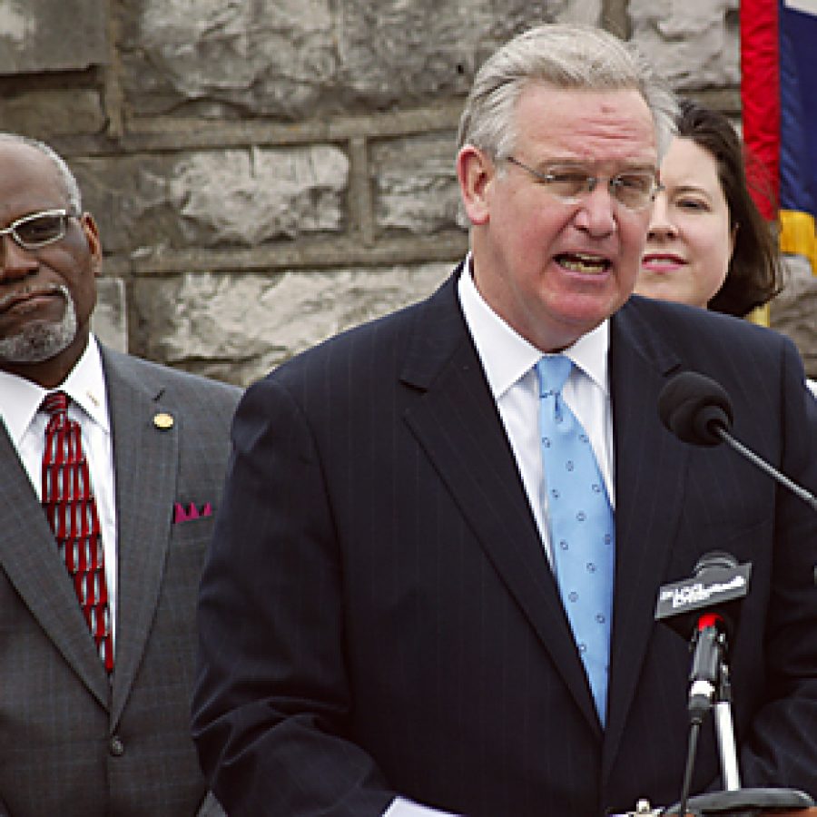 Missouri Gov. Jay Nixon on Friday signed an executive order establishing a new Missouri Civil War Sesquicentennial Commission. Pictured at the signing ceremony at Jefferson Barracks, from left, are: County Executive Charlie Dooley, Nixon and state Rep. Vicki Englund, D-Concord. Bill Milligan photo
