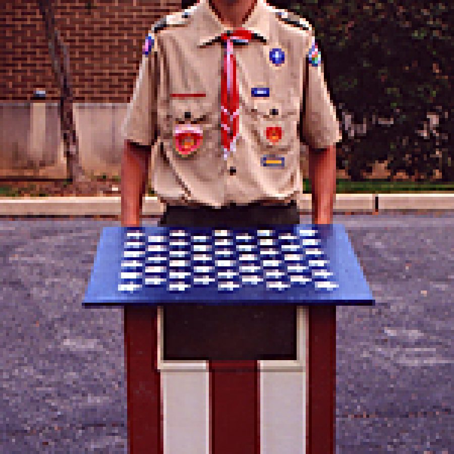 Boy Scout Chris James is shown with one of the flag retirement boxes he created for his Eagle Scout project.
