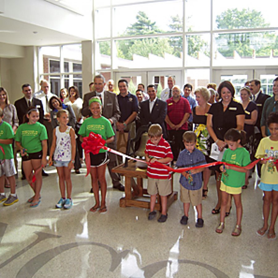 Lindbergh Schools celebrates the grand reopening of Concord Elementary School with a ribbon-cutting ceremony that included ringing a bell discovered during building renovation and restored to its original beauty. The ceremony marked the first time in 50 years the district has opened a new elementary school. Mike Anthony photo