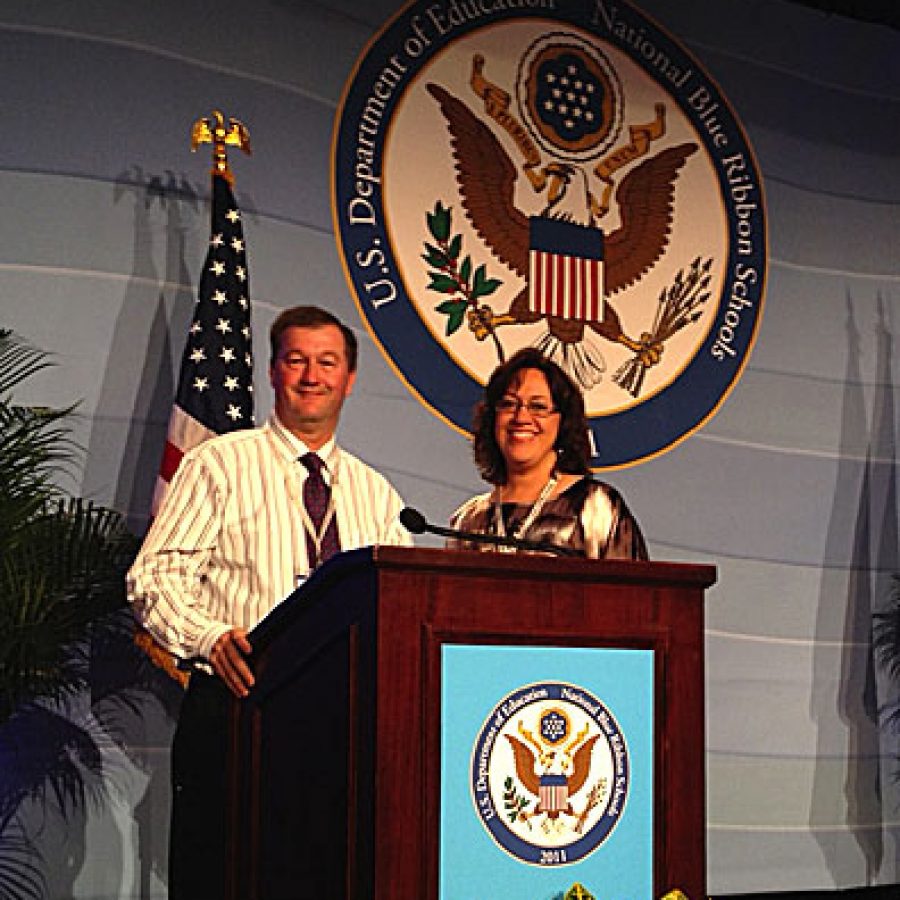 Crestwood Elementary School Principal Scott Taylor and fifth-grade teacher Cindy Kapodistrias accept the National Blue Ribbon School Award for their school during a recent ceremony in Washington, D.C.
