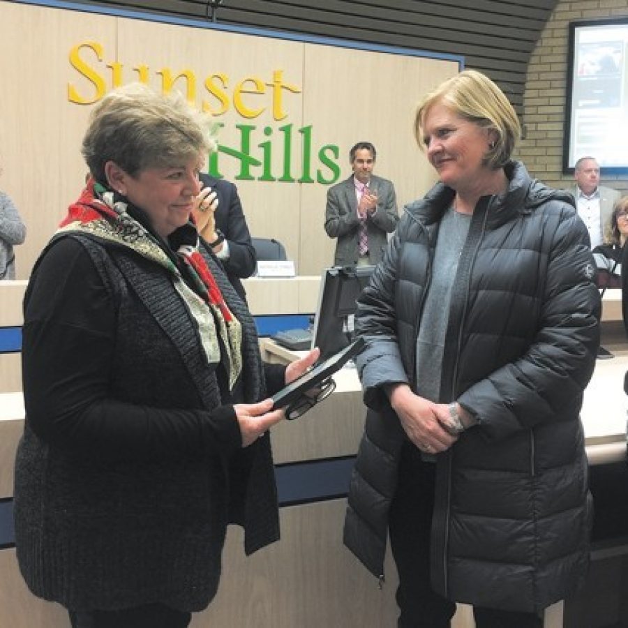 Sunset Hills Mayor Pat Fribis honored the late former Mayor Bill Nolan, who died in September, by proclaiming Dec. 13 William J. Nolan Day. Above, Nolans wife, Mary, left, and daughter Elizabeth Nolan-Purvis accept the honor, which was prompted by a letter to the county from Sri Lankan diplomat Wasantha Perera. She called Nolan a true friend of Sri Lanka.