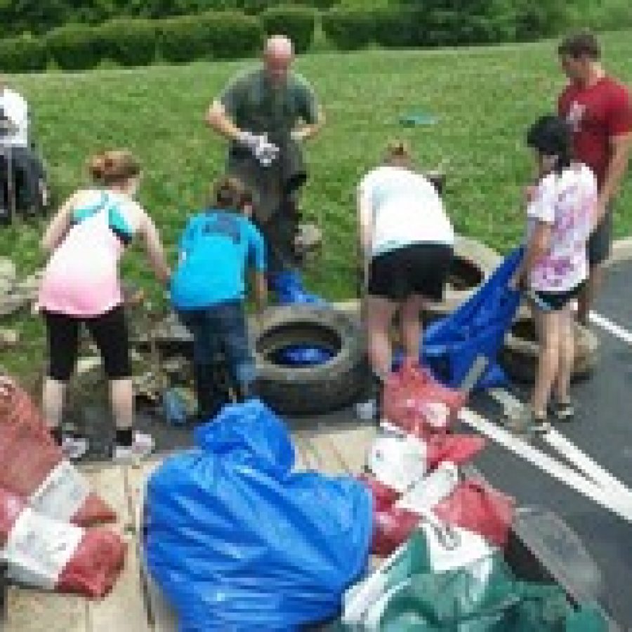 Students in Zoe Geists introductory biology class at the SCEUC clean up the stream behind the center as a service-learning project.
 
 