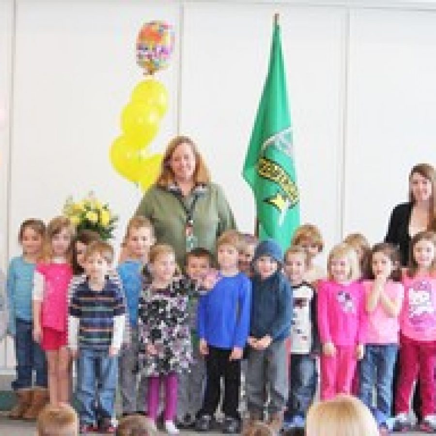 Lindbergh Early Childhood Education teacher Lisa Janis is honored as the National Child Care Teacher of the Year by her prekindergarten students in the Lions class during a surprise announcement last week.
 