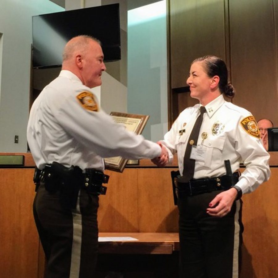 Chief Jon Belmar congratulates Capt. Melissa Webb on her promotion to captain Wednesday.