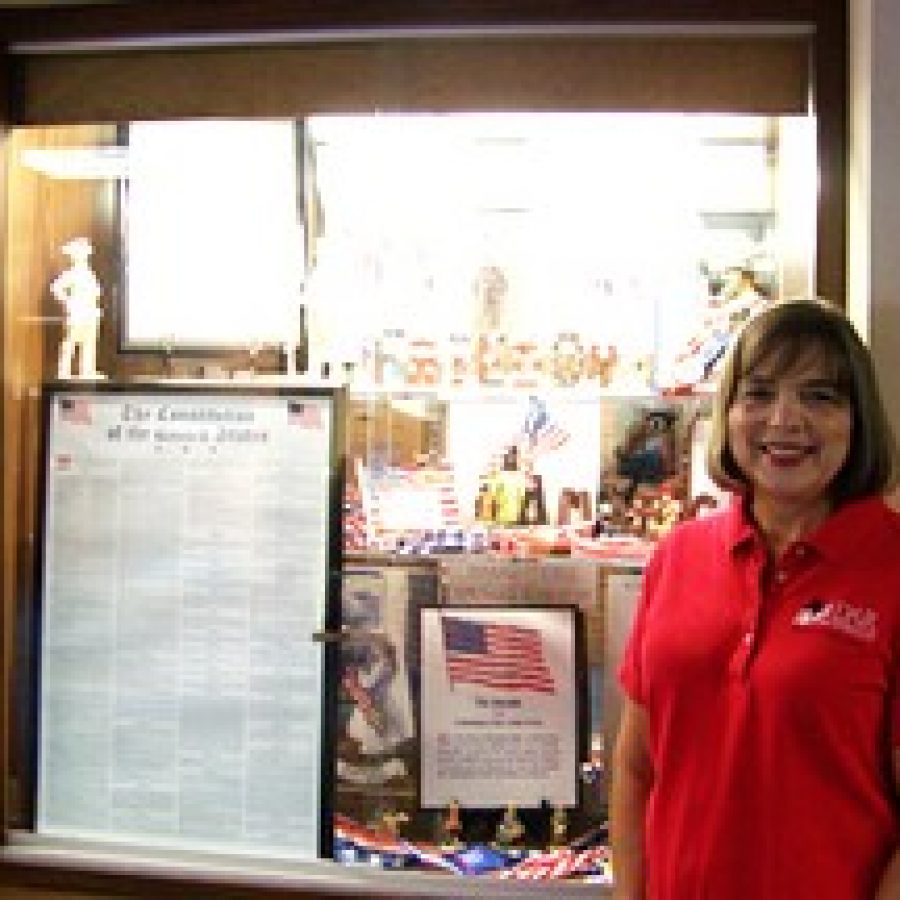 Nora Zimmer, a board member and Historic Preservation co-chair of the Olde Towne Fenton Chapter of the National Society of the Daughters of the American Revolution, is shown alongside the U.S. Constitution display she prepared at the Tesson Ferry Branch County Library, 9920 Lin Ferry Drive. This display will be available for viewing through the month of September.
 