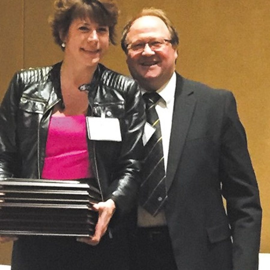 Sales Executive Bea Corbin displays the awards the Call won at the Missouri Press Associations Best Ad Contest last week in Columbia. Also pictured is Les Borgmeyer, vice president of commercial printing for the Columbia Tribune Publishing Co.