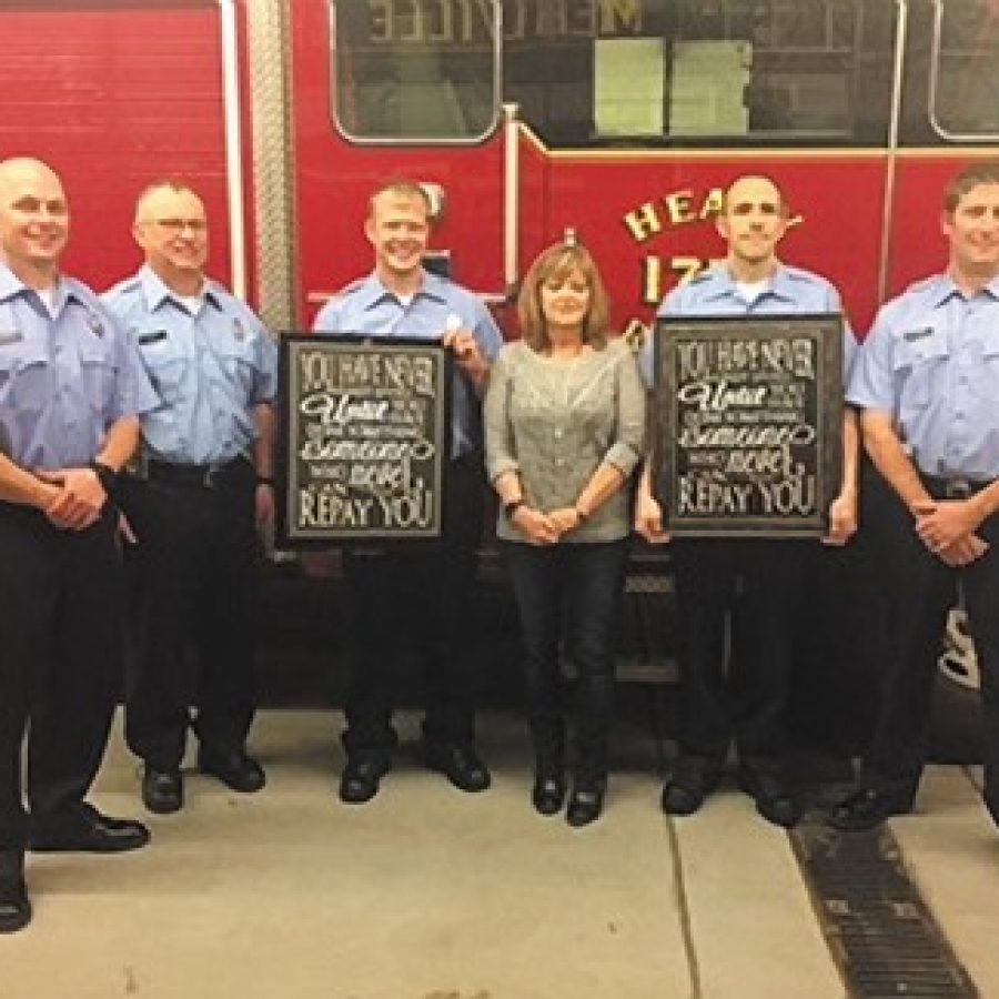 Oakville resident Toni Hodge attended last weeks Mehlville Fire Protection Dis-trict Board of Directors meeting to thank the firefighter/medics who saved her life in October when they responded to a 911 call she made. She presented them with plaques stating she could never repay them for what they did. Pictured, from left, are: Pvt. Darren Plogger, Pvt. Don Wood, Pvt. Jason Schenimann, Hodge, Pvt. Patrick OBrien and Pvt. Nick Klemme.