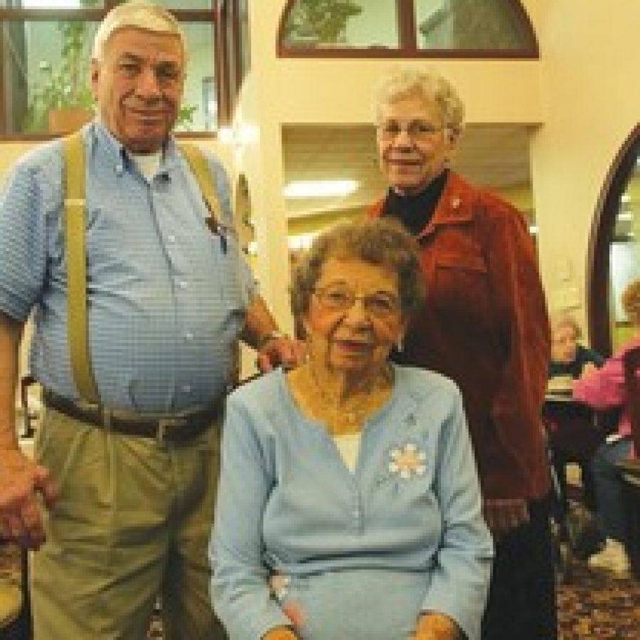 Bill Milligan photo
Herbert Eberle and his sister Gertrude Kedro visit with 94-year-old Ruth Vogel, seated, who baby-sat for them 80 years ago.
 