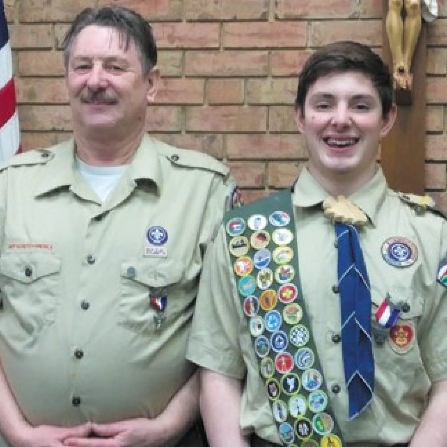 Boy Scout Phillip Harter, right, recently was presented with the rank of Eagle Scout on the 50th anniversary of his father, Charles, left, receiving the Eagle Scout honor.