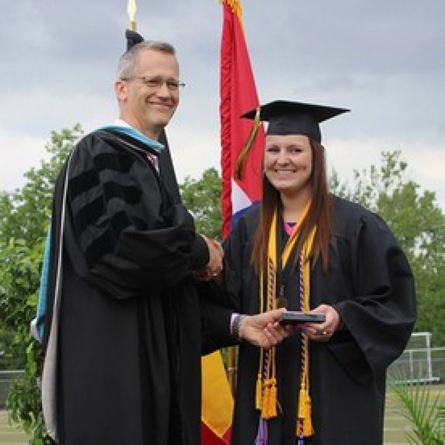 Mehlville School District Superintendent Eric Knost is shown with Oakville Senior High School Valedictorian Lucy Right at Sundays graduation ceremony. 
