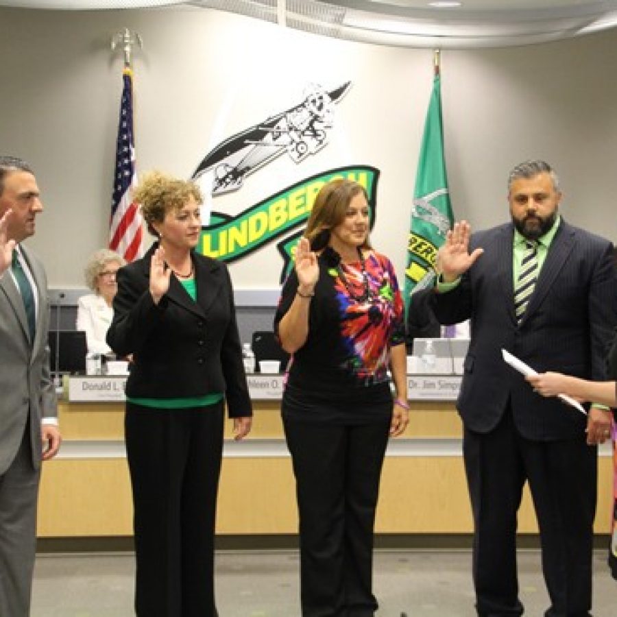 The LAWS slate of new Lindbergh board members are sworn in Tuesday by board Secretary Karen Schuster. Pictured from left are: Mike Shamia, Christy Watz, Cathy Carlock Lorenz and Matt Alonzo.