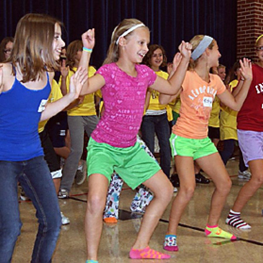 Point Elementary fifth-graders, from left, Sarah Billings, Chloe Dedic, Katie Doerr and Madison Michalski perform an African dance for guests at the Mehlville School Districts fall 60plus event at the school.