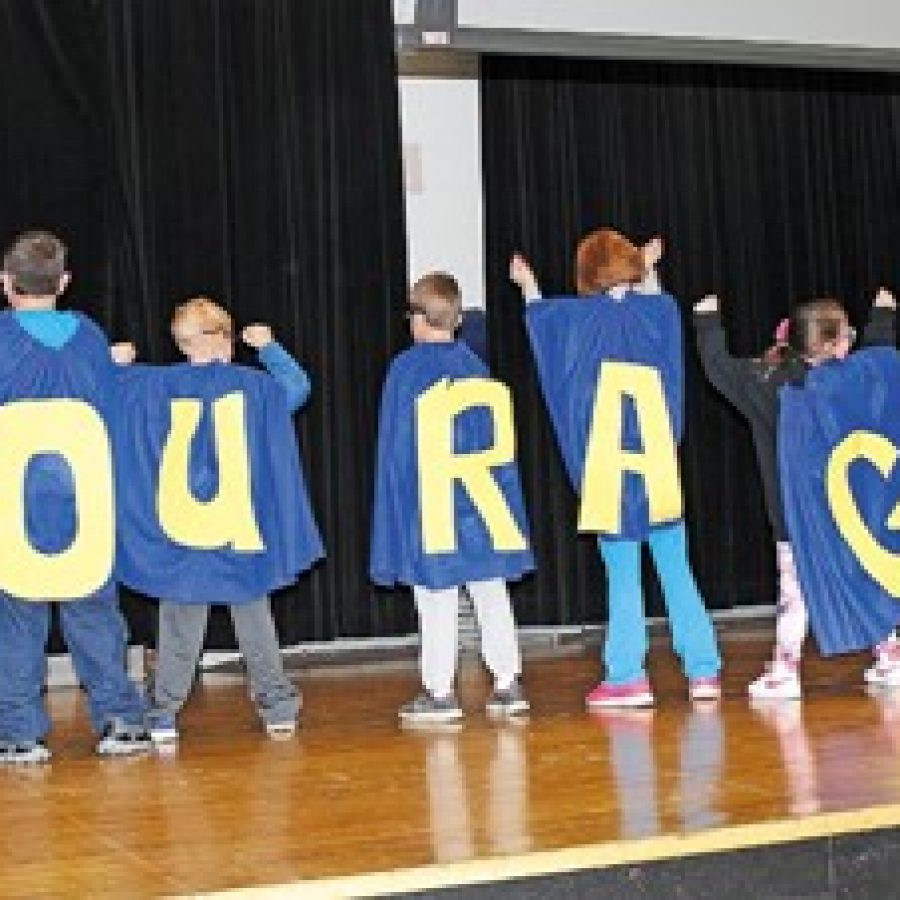 Point Elementary School students perform along with a rap song by Captain Courage during an all-school character assembly. Point Principal Dan Gieseler talked to students last week about the word of the month, courage. As an example, Point counselor Kelly Millan gave a presentation about her husband, Capt. Cesar Millan, who served several tours in Iraq with the U.S. Army.