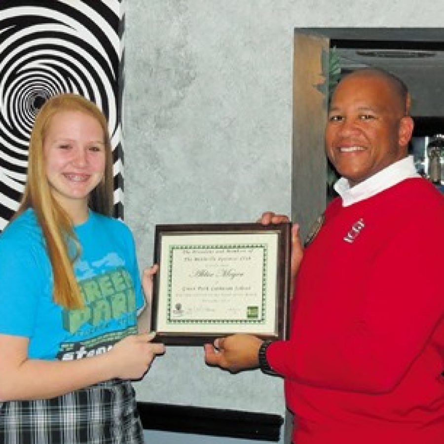The Mehlville Optimist Club recently honored eighth-grader Abbie Meyer of Green Park Lutheran School as its Student of the Month. Also pictured is Optimist Student of the Month chairman John Roland.