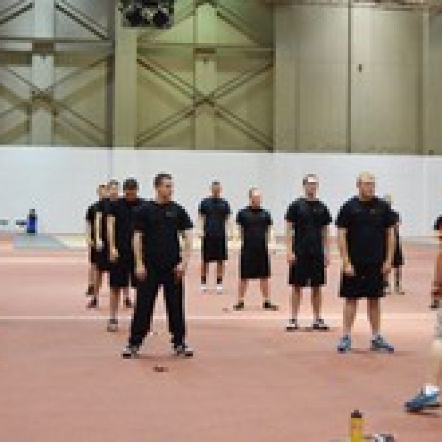 Students are shown participating in the Law Enforcement Training Institute in the Hearnes Center field house at the University of Missouri-Columbia. 