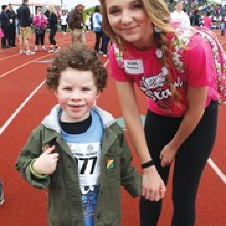 Trautwein kindergarten student Tyler Hornberger is pictured with Mehlville High student Kendra Ryan at the recent Special Olympics event on the Mehlville High campus. 