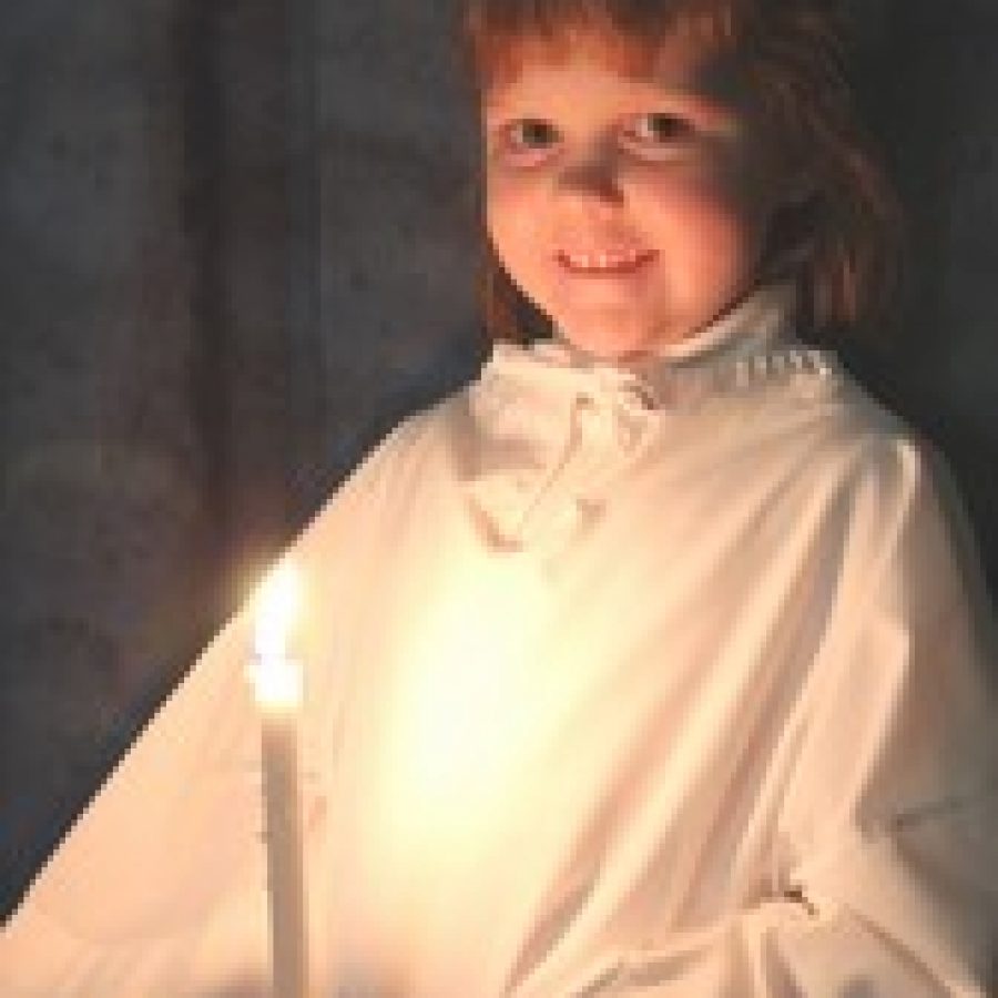 Samantha Fischer portrays a Yule sprite in Peace Lutheran Churchs 20th annual Boars Head Christmas Festival. 