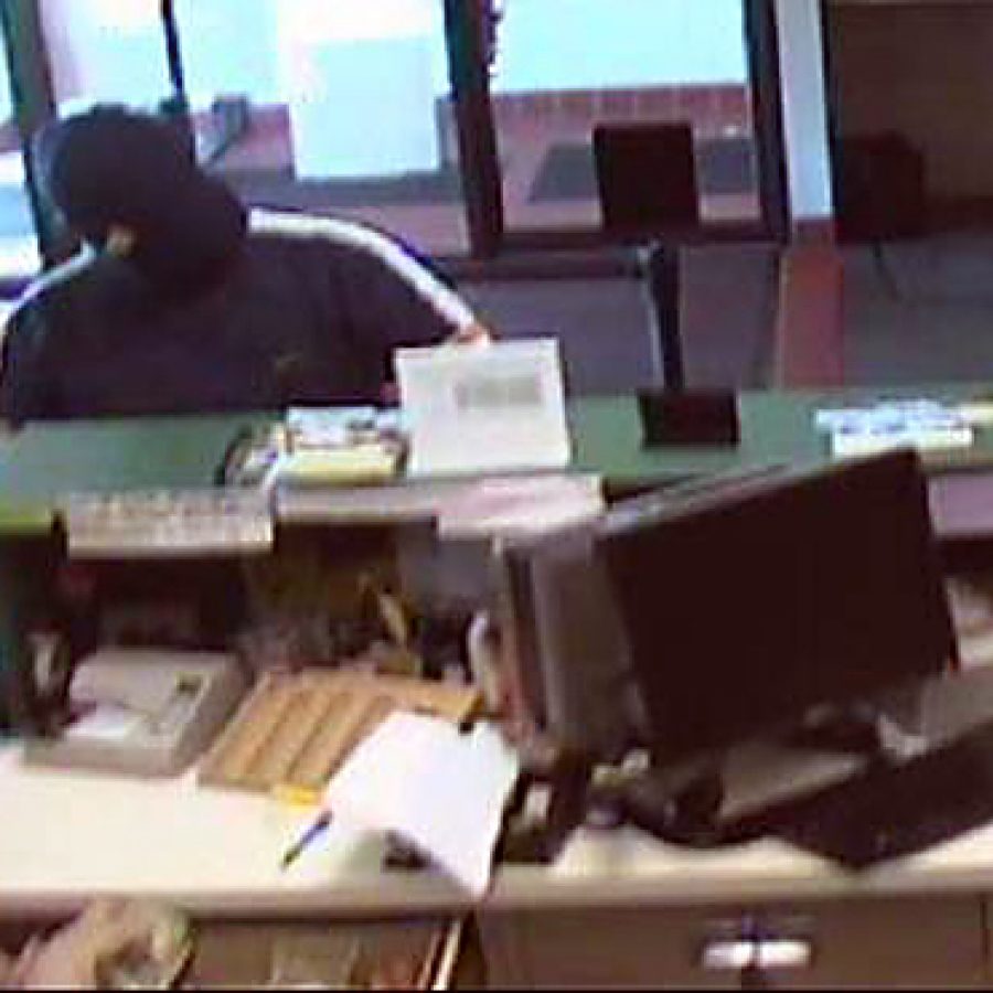 Surveillance cameras capture photos of the man who robbed the Electro Savings Credit Union on Tesson Ferry Road on Friday morning.