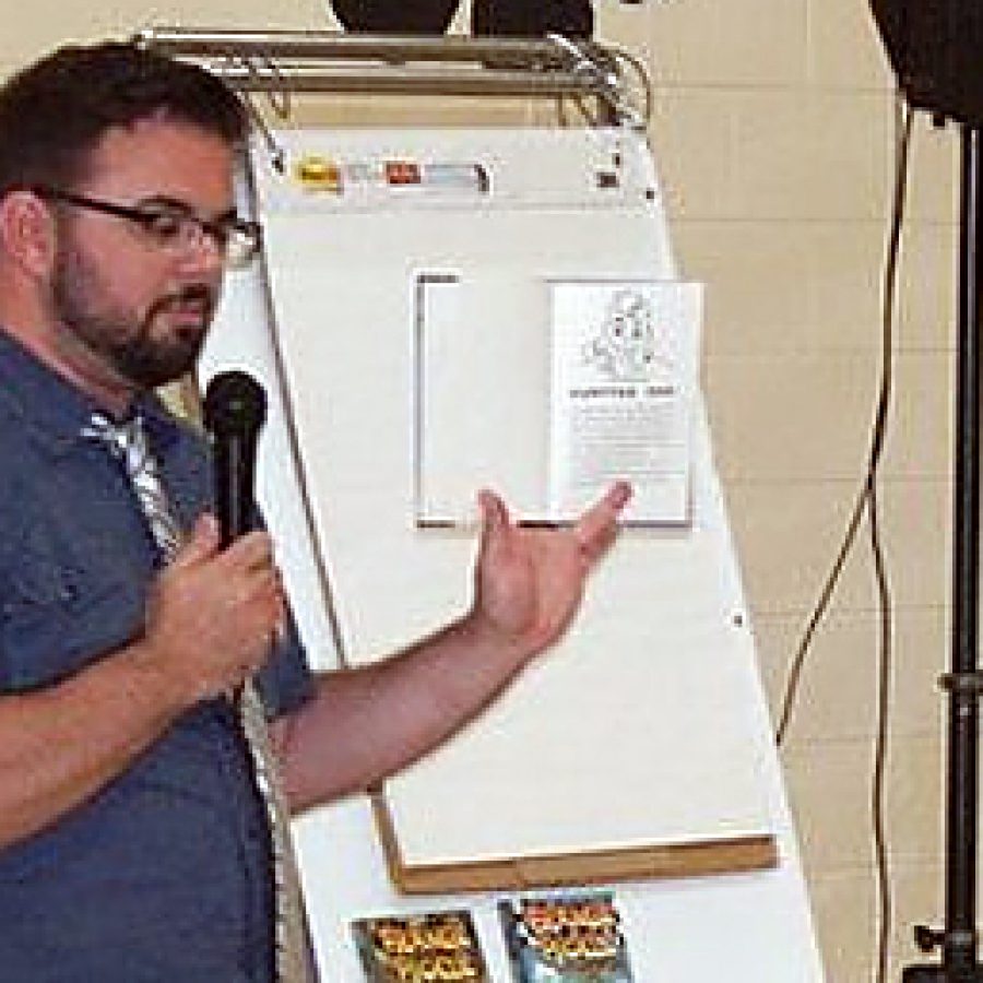 Author and illustrator Eric Wight reads the first chapter of his book, \Frankie Pickle and the Mathematical Menace,\ for the students at Oakville Elementary on Sept. 7. Wight visited the students at Blades, Point, Wohlwend and Oakville Elementary Schools and told students they should never give up because rejection can lead to an even better experience, or in his case, a better job.