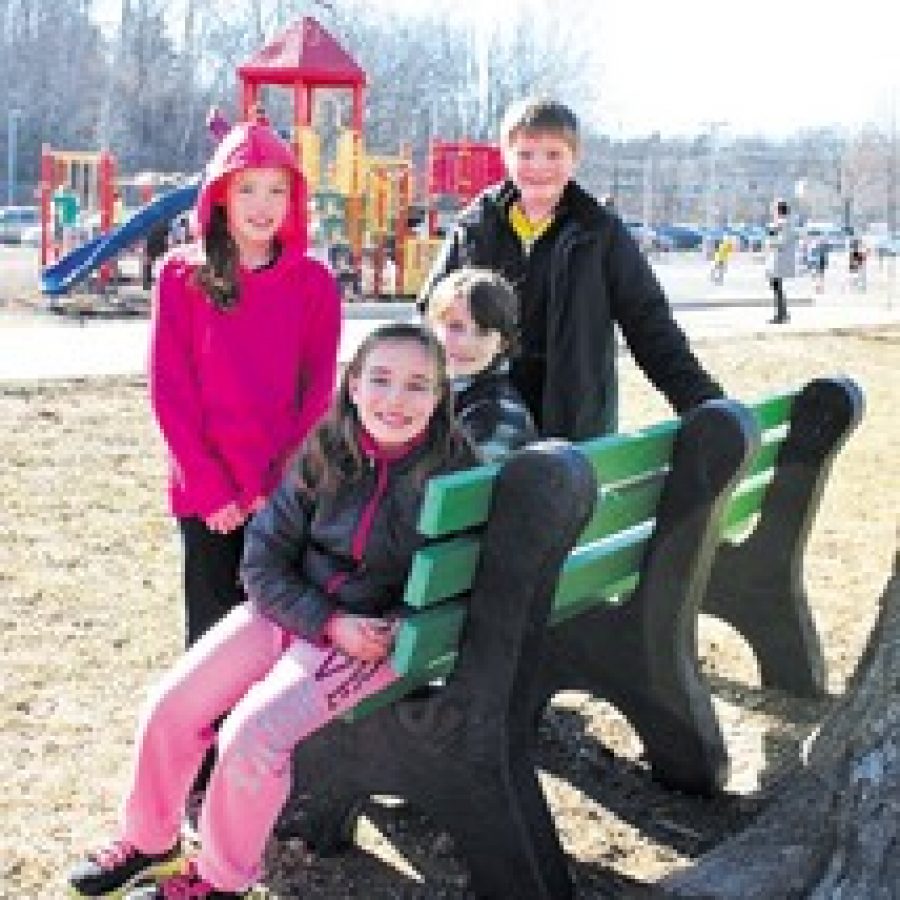 Principal Advisory Committee fourth-grade buddies, from left, Destiny Cole, Audrey Branding, Anthony Hessee and Miles Higdon are pictured hanging out on the new Buddy Bench. 
 