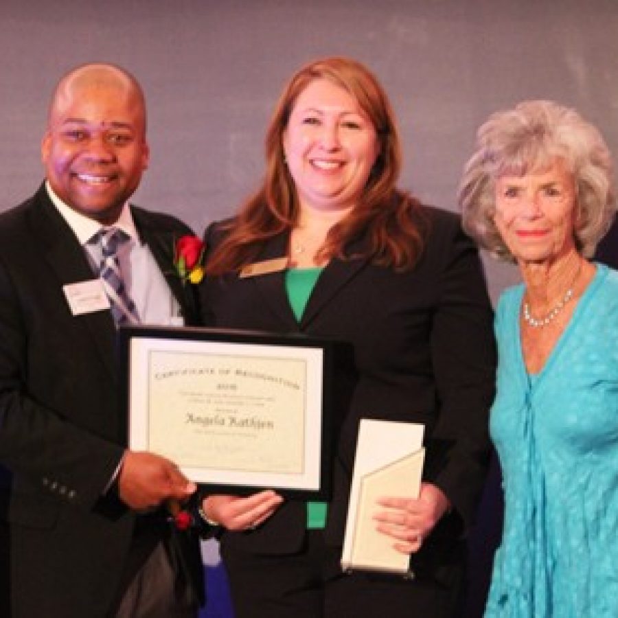 Sperreng Middle School science teacher Angela Rathjen, center, receives the 2015 Loeb Prize for Excellence in Teaching Science and Mathematics. She is pictured with Christian Greer, chief education and programs officer for the St. Louis Science Center, and Carol Loeb, a member of the Science Center Board of Trustees.