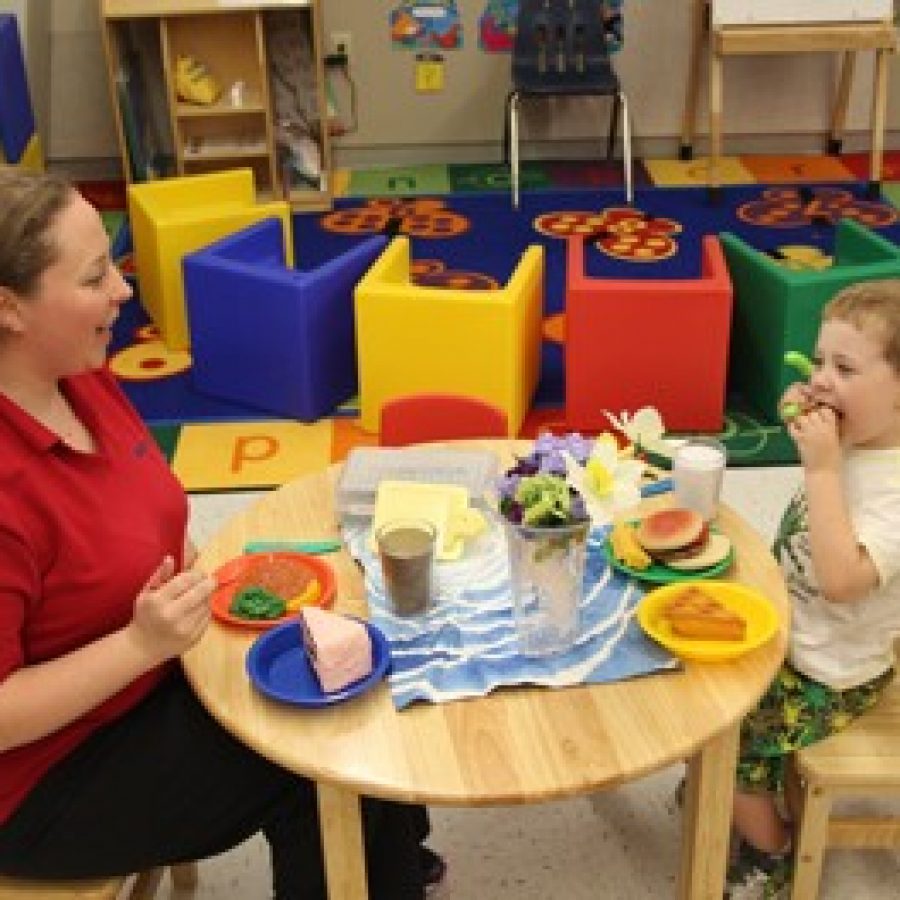 A student and his mom have fun playing in the Dolphin Room at Lindbergh Early Childhood Education during the new buildings open house on Tuesday.