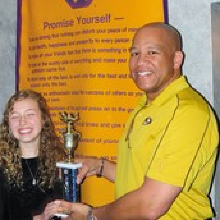 Alexandria Lexi Huether, an eighth-grader at Oakville Middle School, is the Mehlville Optimist Student of the Month. Lexi is pictured with John Roland, Optimist Student of the Month chairman. 