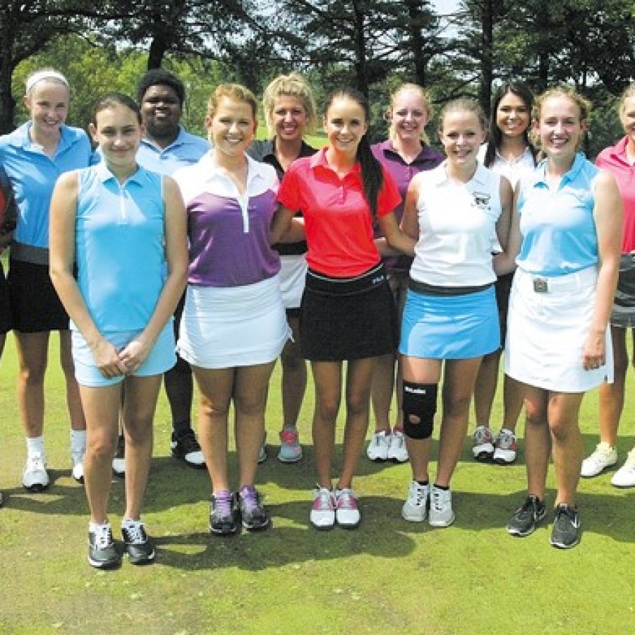 Emily Baker is the new head coach of the Oakville High girls golf team, carrying the torch passed by longtime former head coach Cindy Maulin.