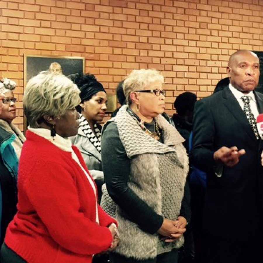 Vinita Park Mayor James McGee, far right, and Cool Valley Mayor Viola Murphy, to his left, talk to reporters after walking out of the Council Chambers in protest of the countys new police standards last week.