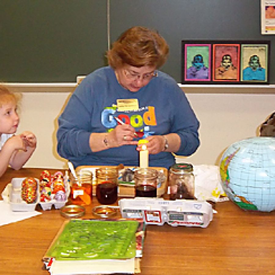 Beasley Elementary librarian Madelynn Kennebeck teaches students the techniques for painting Ukranian eggs during the schools Fine Arts Day held on April 21.