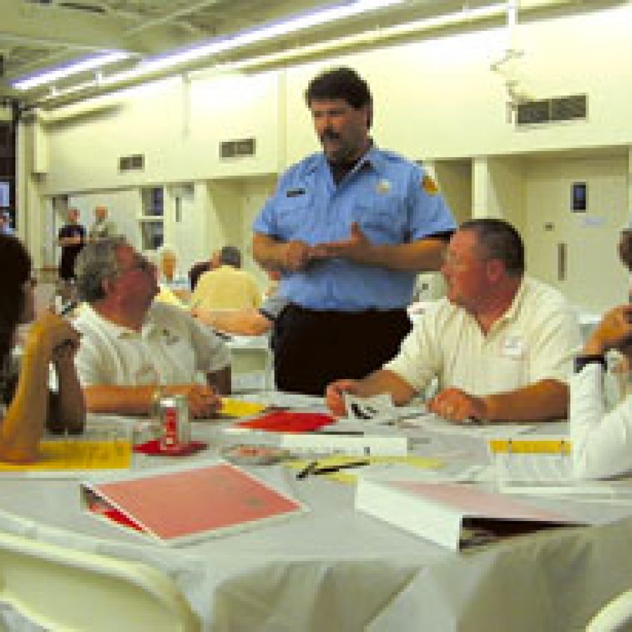 Mehlville firefighter Robert Strinni, standing, speaks with residents during the first meeting of the districts public engagement program, the Fire District Advisory Committee for Tomorrows Emergency Services, or FACTS, that will help chart the districts future.