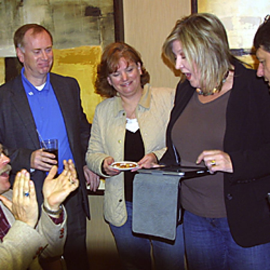 Mehlville Board of Education candidates Rich Franz and Mark Stoner learn they have won election to the board April 5. Pictured, from left, are: Franz; Stoner; Stoners wife, Terri; Miriam Stonebraker; and Greg Frigerio. Franz and Frigerio are founding members of the Mehlville Community Taxpayers Association, a group that opposed Mehlvilles 88-cent tax-rate increase in the November election. Bill Milligan photo