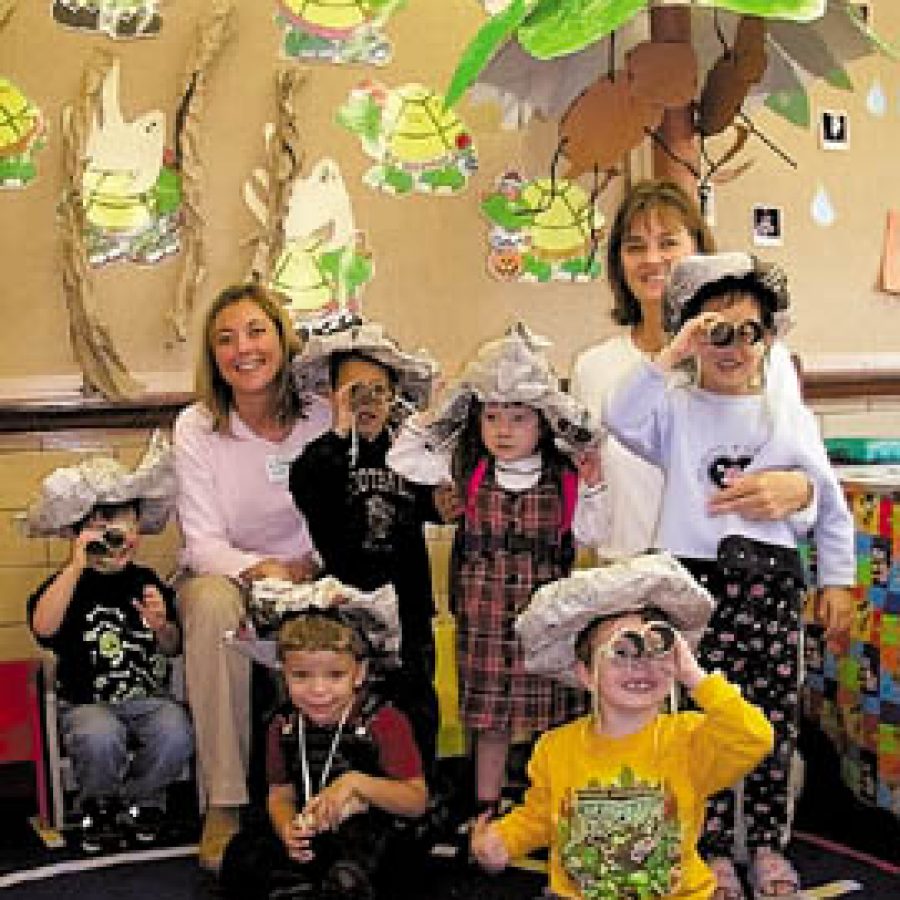 The Mehlville School Districts Early Childhood Center  recently was transformed by youngsters into an enchanted rain forest. Pictured, front row, from left, are: Blake Fischer and Spencer Burch. Back row, from left, are: Jake Lambert, Maggie Naucke, Jlohn Adams, Gigi Gonzales, Cathy Heath and Jenny Ngo.