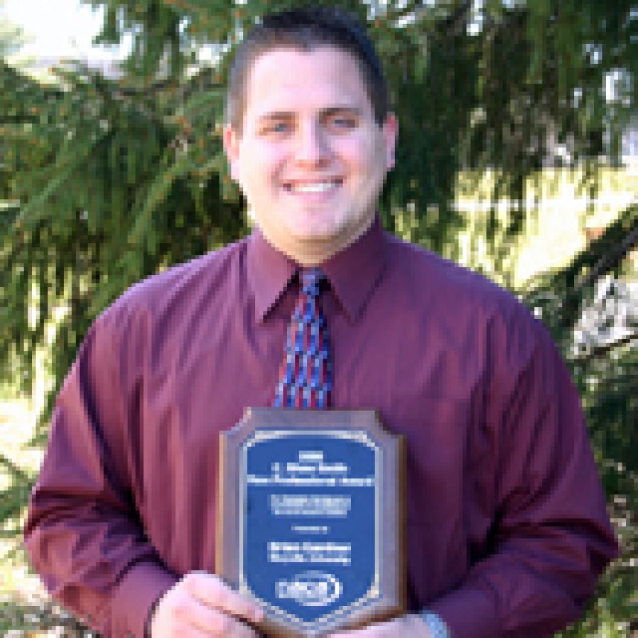 Oakville graduate Brian Gardner displays his C. Shaw Smith New Profes-sional Award for his work on campus activities at Maryville University.