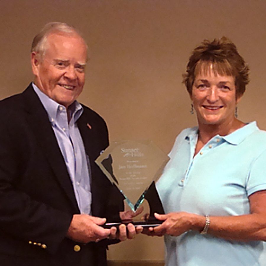 Sunset Hills Mayor Bill Nolan and Ward 3 Alderman Jan Hoffmann are shown with the award presented to Hoffmann for her efforts leading to the construction of the citys first swimming pool and the construction of the citys new Aquatic Center that replaces the original pool.