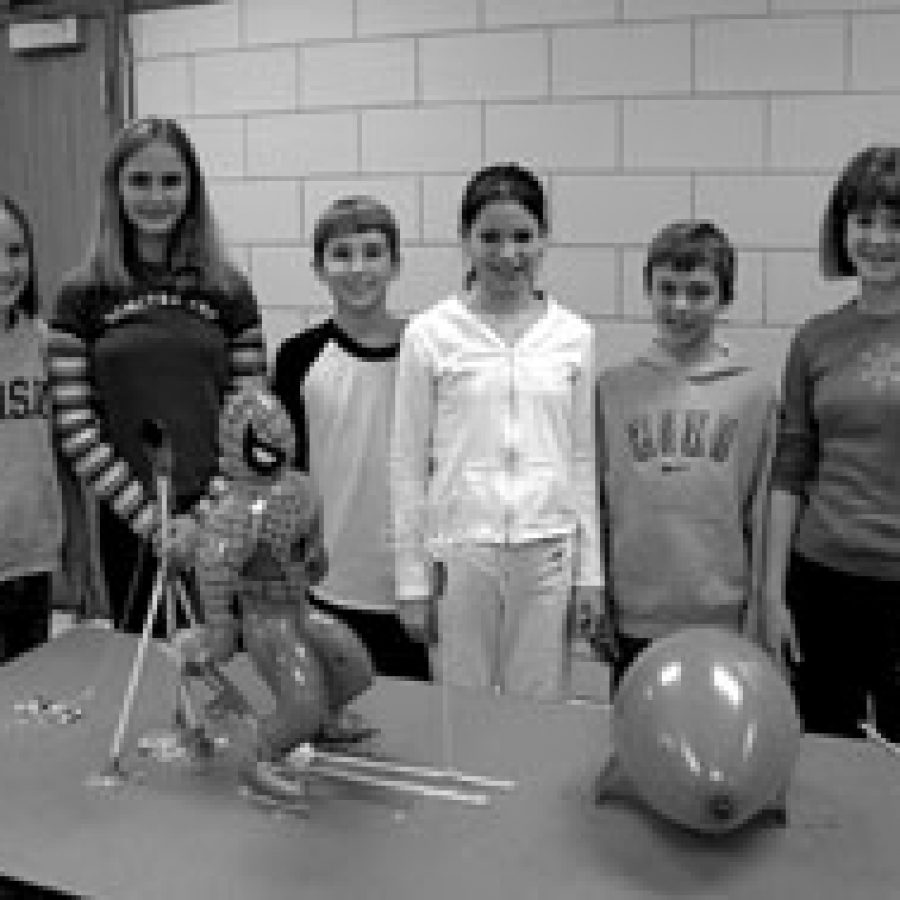 A team from Washington Middle School waits for its \Spider Trap\ entry to be judged in the Rube Goldberg competition during the Mehlville School Districts Invention Convention. The districts STRETCH department sponsored the annual exhibit, which recently displayed pupils creations at Oakville Middle School.  Team members, from left, are: Lindsey Miller, Marsha Wisely, Nathaniel Watts, Corissa Saller, Devin Klein and Emily Wich.