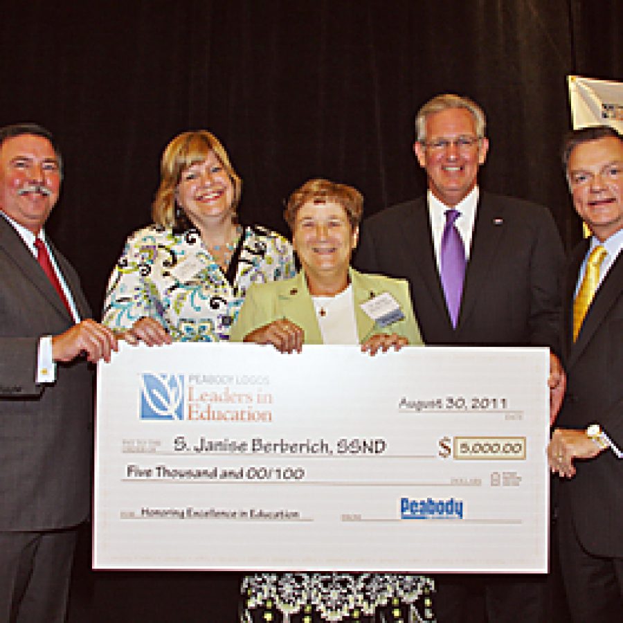 Sister Janise Berberich, a Notre Dame High School teacher, was named last week the Peabody Energy Leaders in Education \Educator of the Year.\ Pictured, from left, are Express Scripts CEO George Paz; Kathy Boyd Fenger, head of Logos Schools;  Berberich; Gov. Jay Nixon and Peabody President and CEO Greg Boyce.