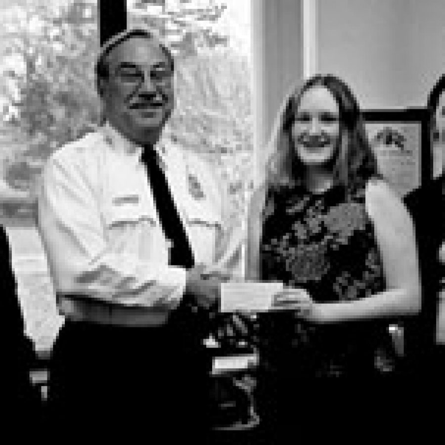 Lemay Fire Protection District Chief Neil Svetanics accepts the donation from Bethel No. 19 of Jobs Daughters. Pictured, from left, are: Kim Bayer, Svetanics, Sara Glover and Sara Cole.
