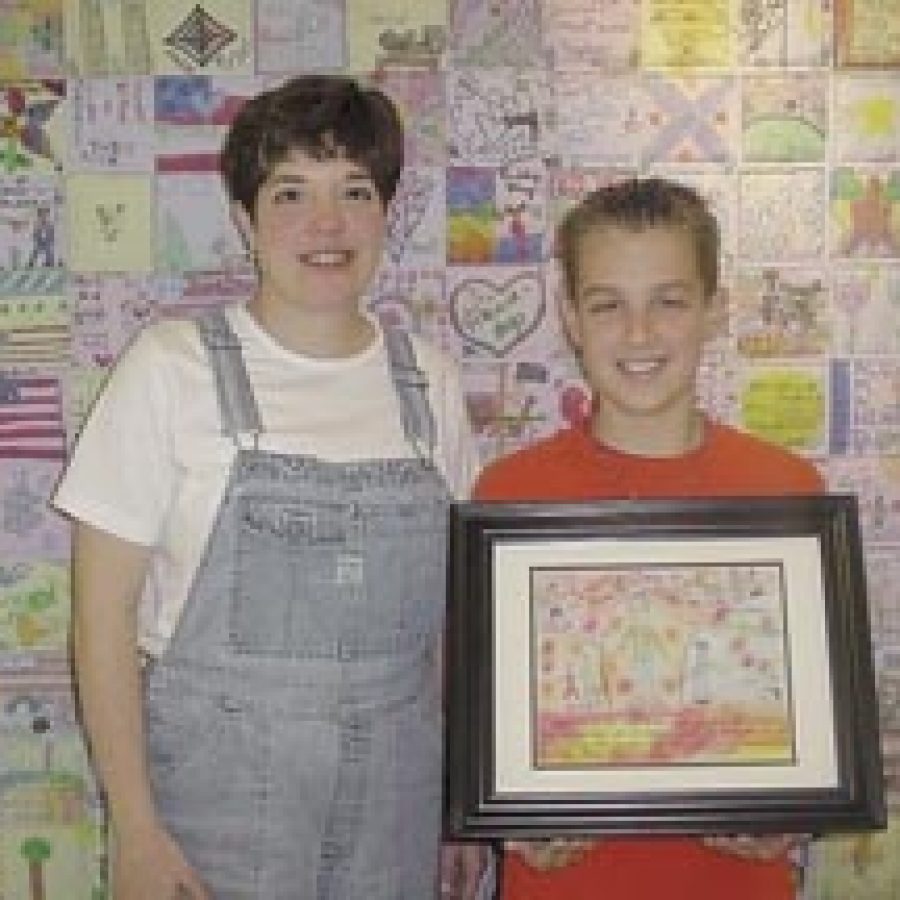 Trautwein sixth-grade teacher Mary Ellen Roungon and pupil David Zink are shown with Davids prize-winning picture.