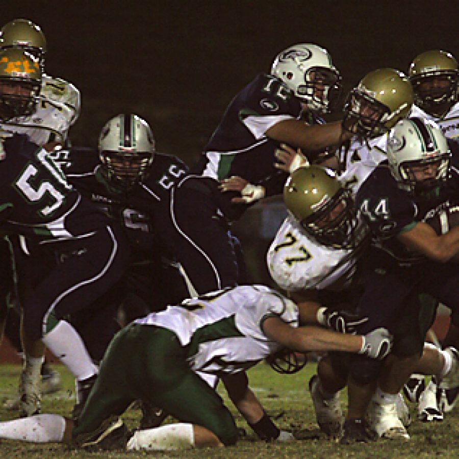 Marquette running back Ryan Schaefer is taken down by Lindberghs Tom Million in the Flyers 34-21 win at Marquette Friday night. Stephen Glover photo