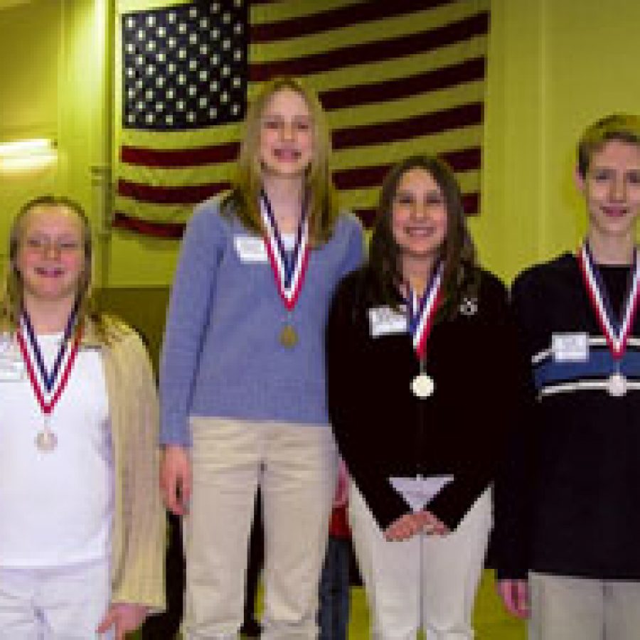 The Scholar Quiz champion at the 23rd annual Middle School Academic Olympic Day was the Washington B team. Members of the championship team, from left, are: Kelly Schuering, Margaret Buehler, Stephanie Rapisardo and Michael Wisely.