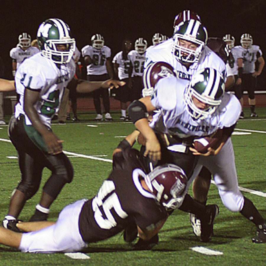 Stephen Glover photo
Mehlville junior running back Troy Parrot is hauled down by De Smet linebacker Reid Spalding in the Panthers 38-0 loss Friday night. Stephen Glover photo