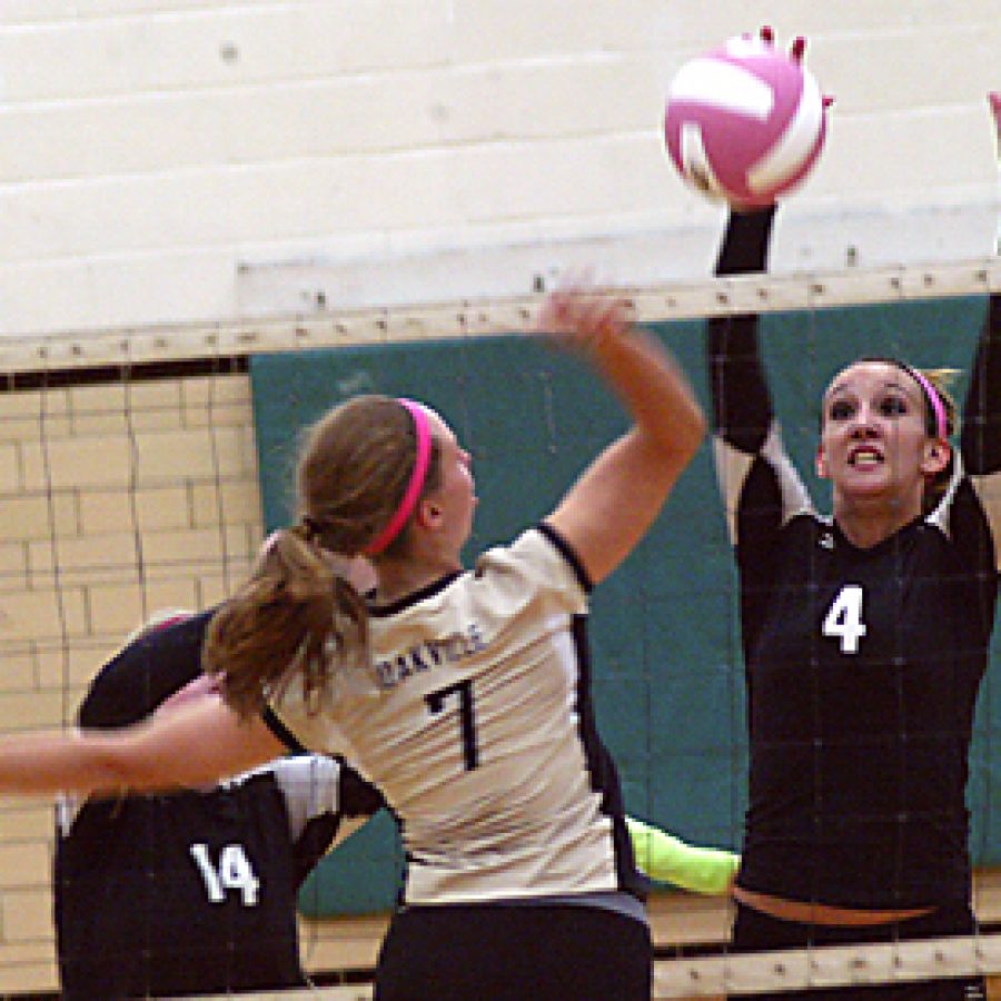 Oakville High's Jennifer Brendel, No. 7, squares off against Mehlville High's Lauren Cliffe as the Tigers defeated the Panthers 2-0 in the Sept. 22 contest. The Oakville girls' volleyball team went on to defeat Lafayette 2-1 the next day and now boasts an 11-3 record on the season. Bill Milligan photo