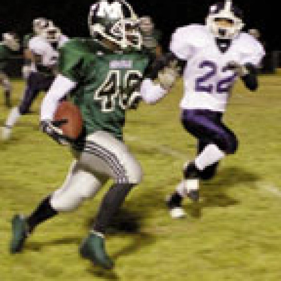 Mehlvilles Rickey Giles, left, runs for a touchdown in Fridays game against the Marquette Mustangs. Giles ran for 58 yards and caught two touchdown passes.
Bill Milligan photo 