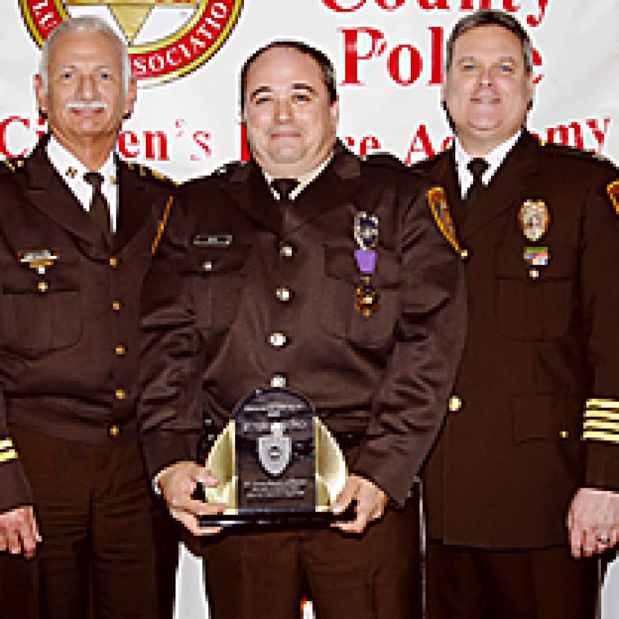 The St. Louis County Police Department Citizens Police Academy Alumni Association of south county selected Russ Bono as its Officer of the Year last year. Pictured, from left, are: County Executive Charlie Dooley, Capt. Marion Monteleone, Bono, Chief Tim Fitch and Lt. Col. Ken Cox. Bono was presented an engraved plaque and a \$1,000 check along with resolutions from the Missouri House and Senate and a St. Louis County proclamation.