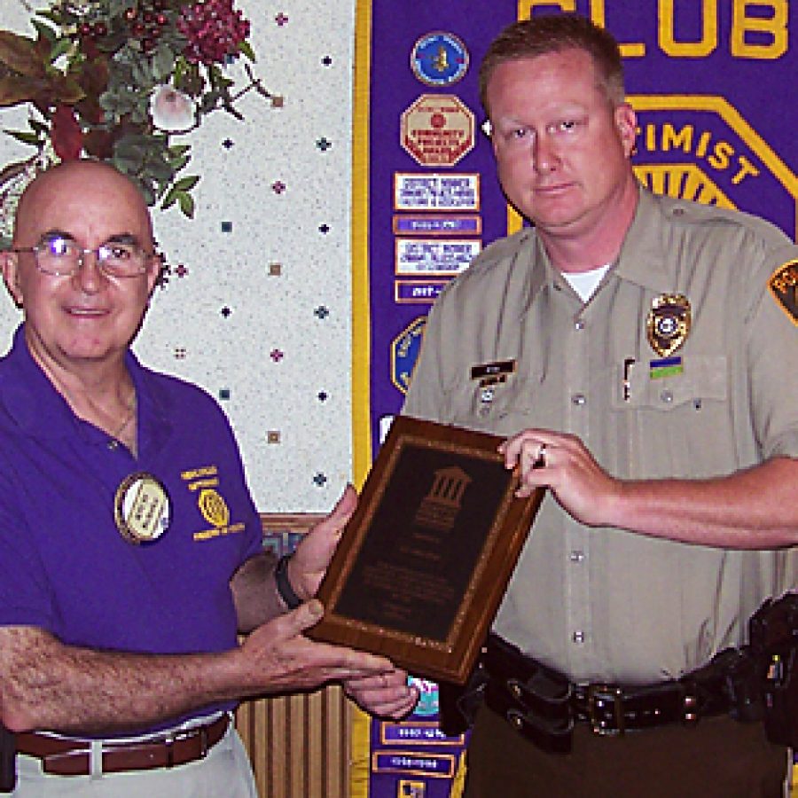 Mehlville Optimist Club Respect for Law Chairman Richard Behnke, left, presents the clubs Officer of the Year plaque to Sgt. David Ryan of the St. Louis County Police Department.